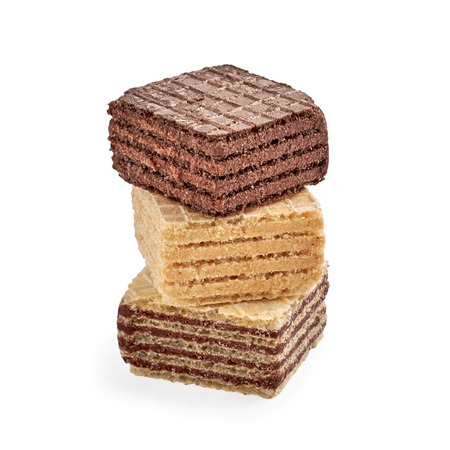 Stack of mixed square wafer biscuits isolated on white backdrop. closeup viewの写真素材