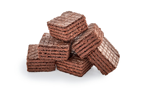 heap of chocolate square brownie wafer biscuits isolated on white backdrop. closeup viewの写真素材
