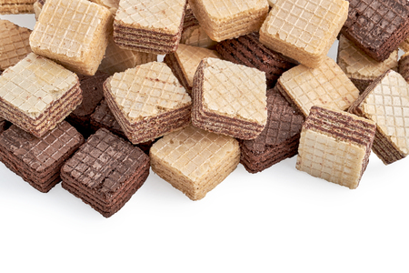 heap of mixed square wafer biscuits isolated on white background. Top viewの写真素材