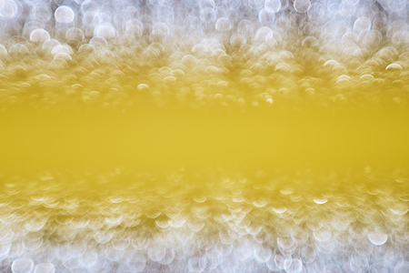 Blurred yellow bokeh background, great design for any purposes.の写真素材