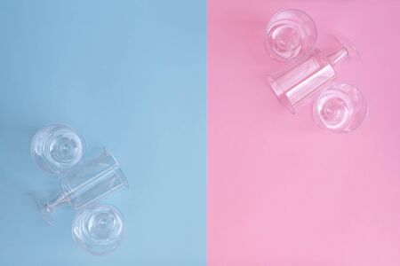 transparent plastic utensils for desserts in pastel pink and blue colors. Copy space, flat layの写真素材