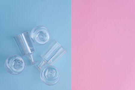 transparent plastic utensils for desserts in pastel pink and blue colors. Copy space, flat layの写真素材
