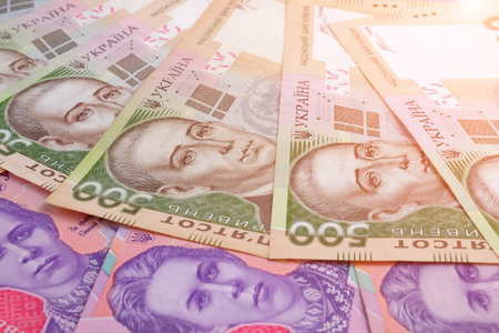 pile of ukrainian banknotes value of 500 and 200 hryvnia UAH as background. Closeup view