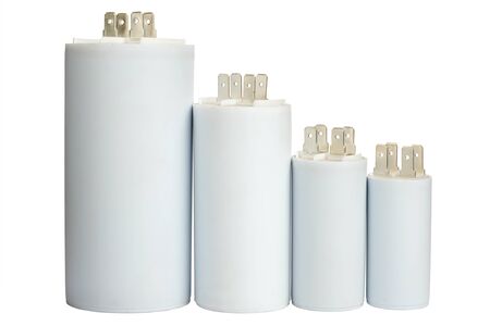 Group white electrolytic capacitors in row isolated on white background, closeup viewの写真素材