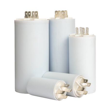 Group white electrolytic capacitors in row isolated on white background, closeup viewの写真素材