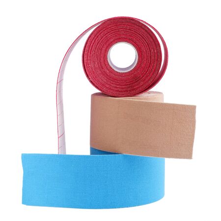 three rolls kinesiology tape for athletes isolated on white background. Kinesiology taping manipulate nerve receptors and reduces pain in muscles and speeds up the healing processの写真素材