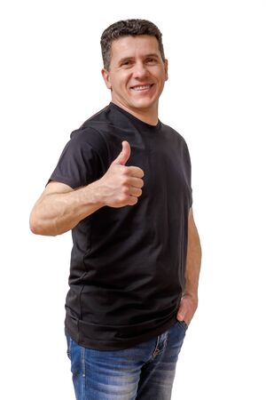 Smiling middle-aged caucasian man gesturing thumb up isolated on white backgroundの写真素材