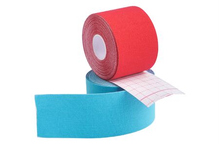 two rolls kinesiology tape for athletes isolated on white background. Kinesiology taping manipulate nerve receptors and reduces pain in muscles and speeds up the healing processの写真素材