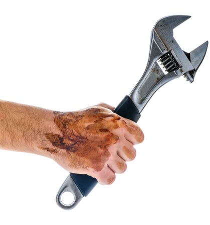 Dirty and oily hand holding adjustable wrench tool isolated on white background.の写真素材