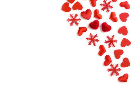 Festive composition from red hearts and snowflakes scattered and isolated on white background, valentines day concept, copy space for text, flatlayの写真素材
