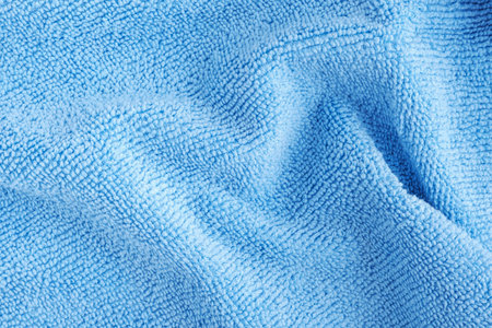 Wrinkled blue microfiber cloth texture of microfiber towel closeup