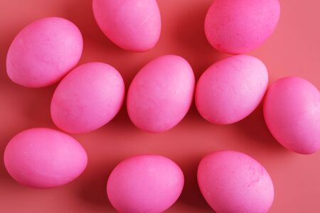 scattered Easter Eggs On Pink Background, flat lay, easter festive backgroundの写真素材