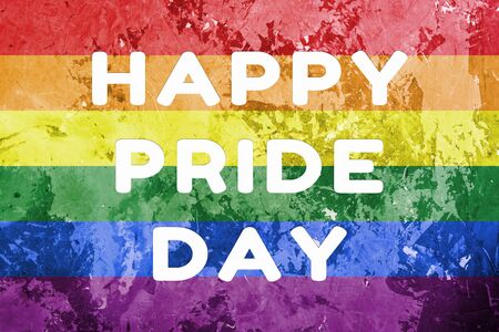 gay rainbow flag with horizontal stripes on concrete background with happy pride day text. lgbt equal right conceptの写真素材