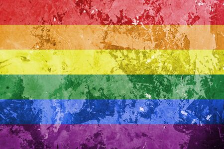 gay rainbow flag with horizontal stripes on concrete background as lgbt symbol. Pride day concept, flat lay, copy space for textの写真素材