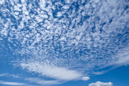 Beautiful white cirrus clouds on summer blue sky background.の写真素材