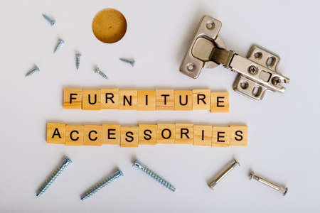 furniture hinge in the new kitchen cabinet door closeup, flat layの写真素材