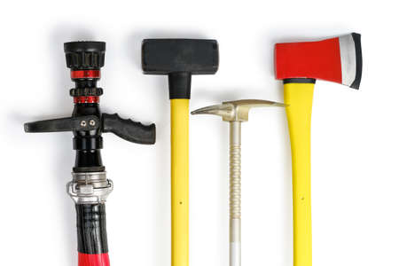 Large yellow sledgehammer, axe, hooligan and fire hose from firemans toolbox isolated on white background. Top view, flatlayの写真素材