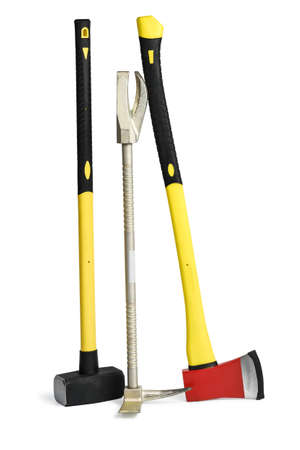 Large yellow sledgehammer, axe and hooligan forcible entry tool from firemans toolbox isolated on white background.の写真素材