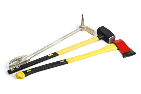 Large yellow sledgehammer, ax and hooligan pinch-bar from firefighter's toolbox isolated on white backgroundの写真素材