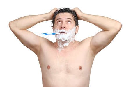 Shocked middle-aged white man with toothbrush in his mouth, brushing teeth, washing head, looks up and hurry, being late for work or meeting, overslept, isolated on white background.の写真素材