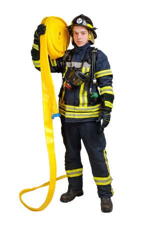 Full body young brave man in uniform and hardhat of firefighter holds fire hose on his shoulder isolated on white backgroundの写真素材