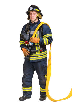 Full body young brave man in uniform and hardhat of firefighter holds firehose nozzle in hands and looking at camera isolated on white backgroundの写真素材