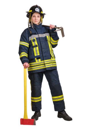 Young brave woman in uniform and hardhat of firefighter with crowbar in hands looking at camera on white background.の写真素材
