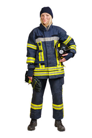Young brave woman in uniform firefighter holds gloves and hardhat in hands and looking at camera isolated on white background.の写真素材