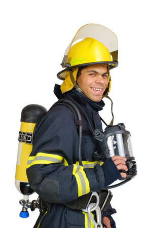 Young smiling African American fireman with respirator and air breathing apparatus on his back in protective uniform isolated on white background.の写真素材