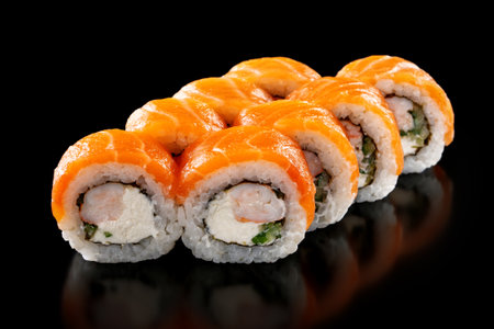 Closeup fresh Sushi Rolls with shrimp, cucumber and cheese philadelphia isolated on black backgroundの写真素材