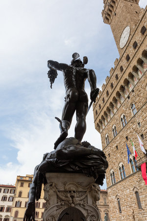 Perseus with the Head of Medusa is a bronze sculpture made by Benvenuto Cellini in 1545.  from the back, you can see the self-image of the sculptor Cellini on the backside of Perseus' helmet.の写真素材