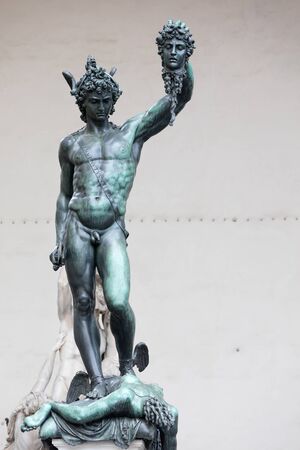 Perseus with the Head of Medusa is a bronze sculpture made by Benvenuto Cellini in 1545.  from the back, you can see the self-image of the sculptor Cellini on the backside of Perseus' helmet.の写真素材