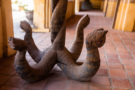 Vientiane, Laos, November 22,  2016 ; Hang Hod in Vat Sisaket. a long narrow wooden naga,  member of a semidivine race, part human and part cobra used for water blessingのeditorial素材
