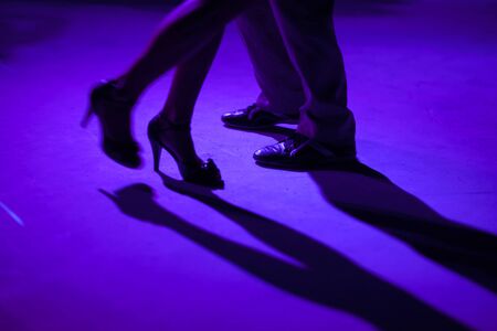 Tango dancers in milonga ballroom, detail of shoes.の写真素材