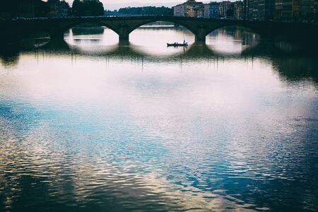 View of bridge on the Arno river,  Florence, Italyの写真素材