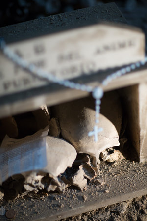 Skull and bones in ancient ossuary, Naples