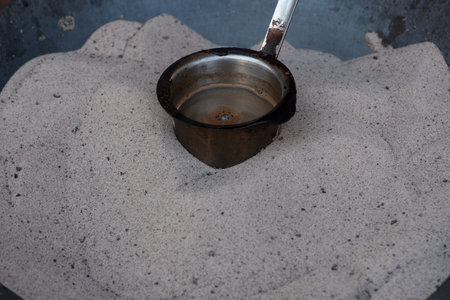 Preparation of desert arabic coffee on hot sand