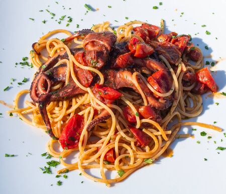 Spaghetti alla Luciana,traditional dish with octiopus and tomato sauceの写真素材