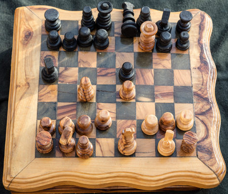 Barber checkmate, on wooden chessboard backround