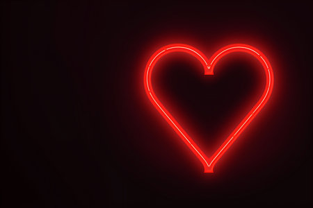 Neon glowing heart on a dark background for Valentine's day. Neon glowing sign.の素材