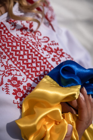 Ukrainian woman in national dress with blue and yellow satinの写真素材
