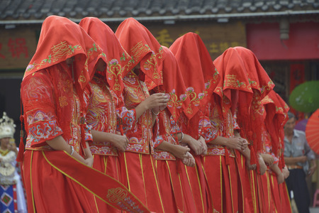 Brides under the red veilの写真素材