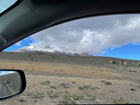 View from the car window on mountains and the blue sky with cloudsの写真素材