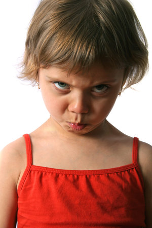 Offended little girl. Isolate on white background.
