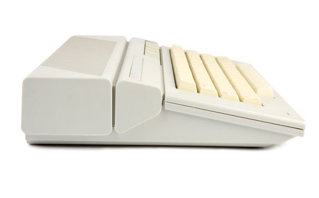 Old home computer. Isolate on white.