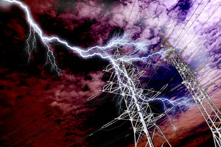 High voltage power line pillar on the background of skyの写真素材