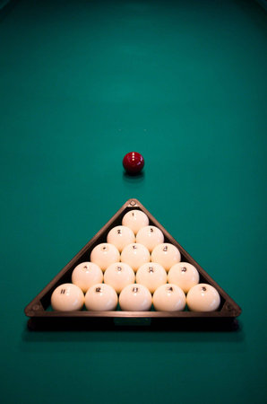 Billiard set on green table close-up image