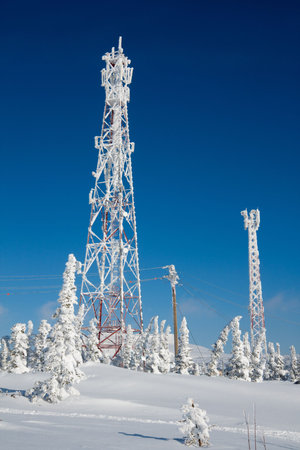 Communication antenn post with frost crystals in cold winter day