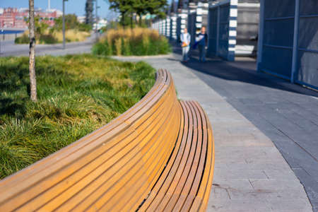 wood bench in park in the big cityの写真素材