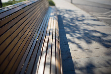 wood bench in park in the big cityの写真素材